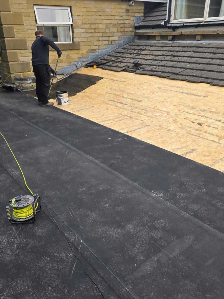 J5 contractor installing EPDM rubber roofing membrane