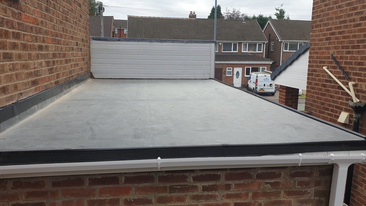 Modern flat roof installed by J5 Roofing with a clean waterproof finish