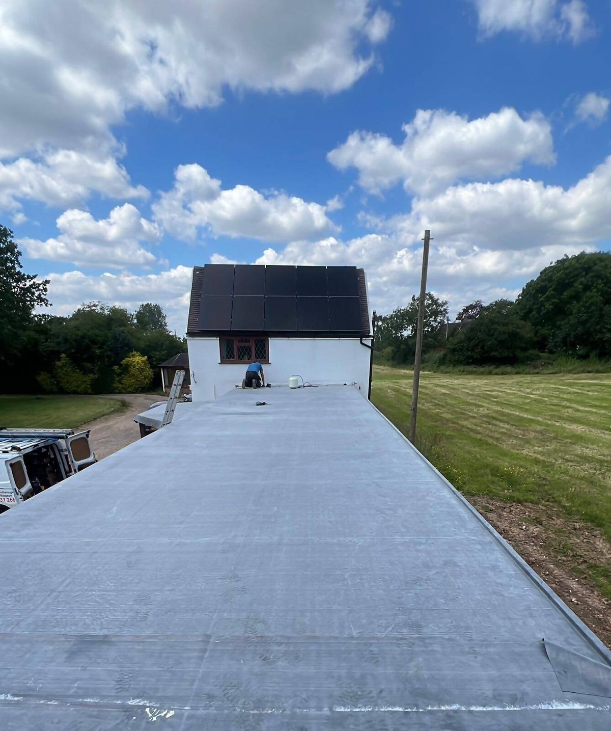 Long flat roof being installed by a J5 roofer